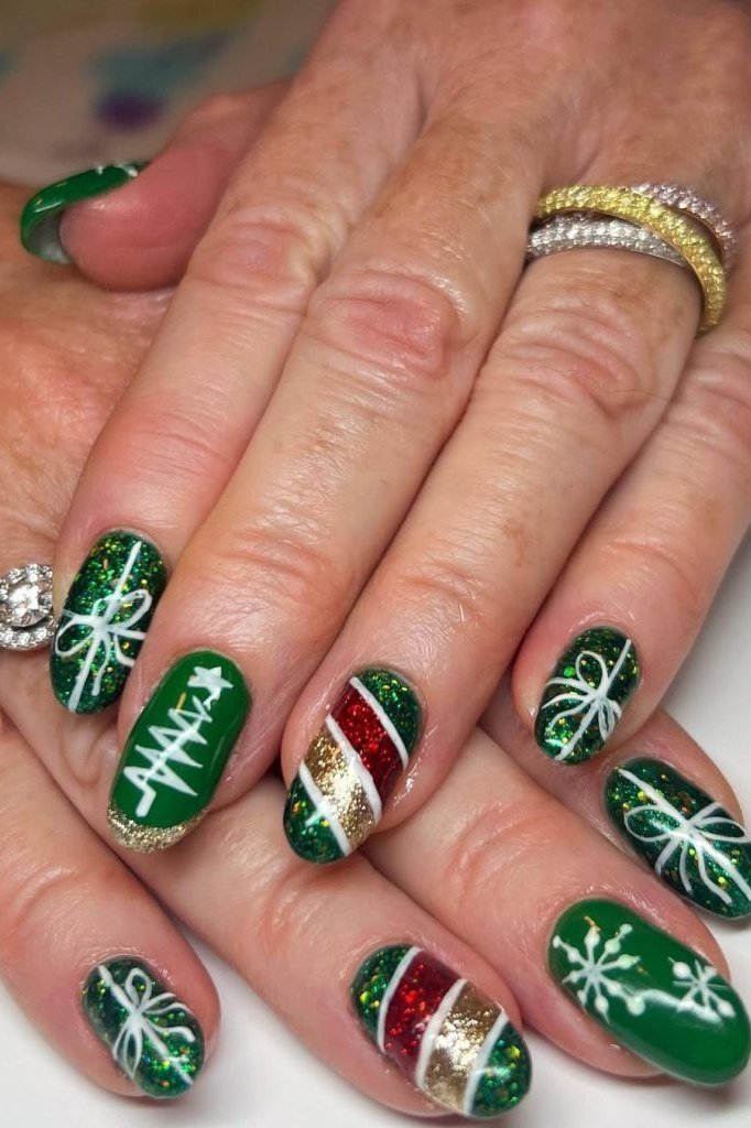 Mature hands, dark green nails with white snowflake and stripe art - classy Christmas nail idea for women over 70