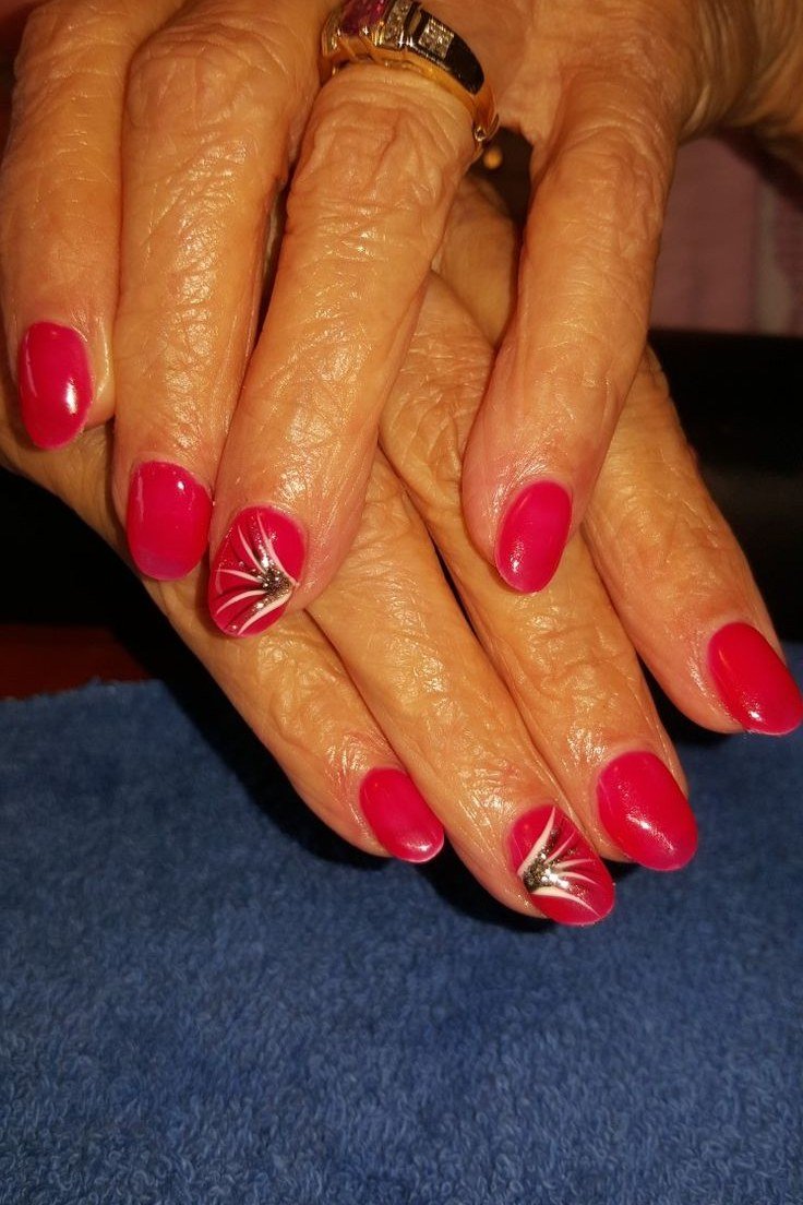 Cherry red nails with white starburst art