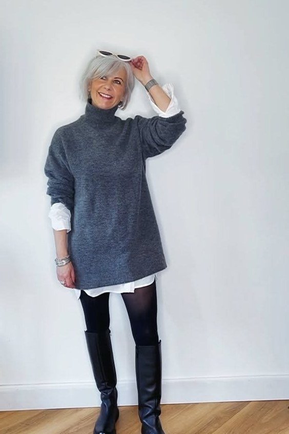 Effortlessly chic fall outfit for women over 60: grey sweater tunic with leggings and knee boots