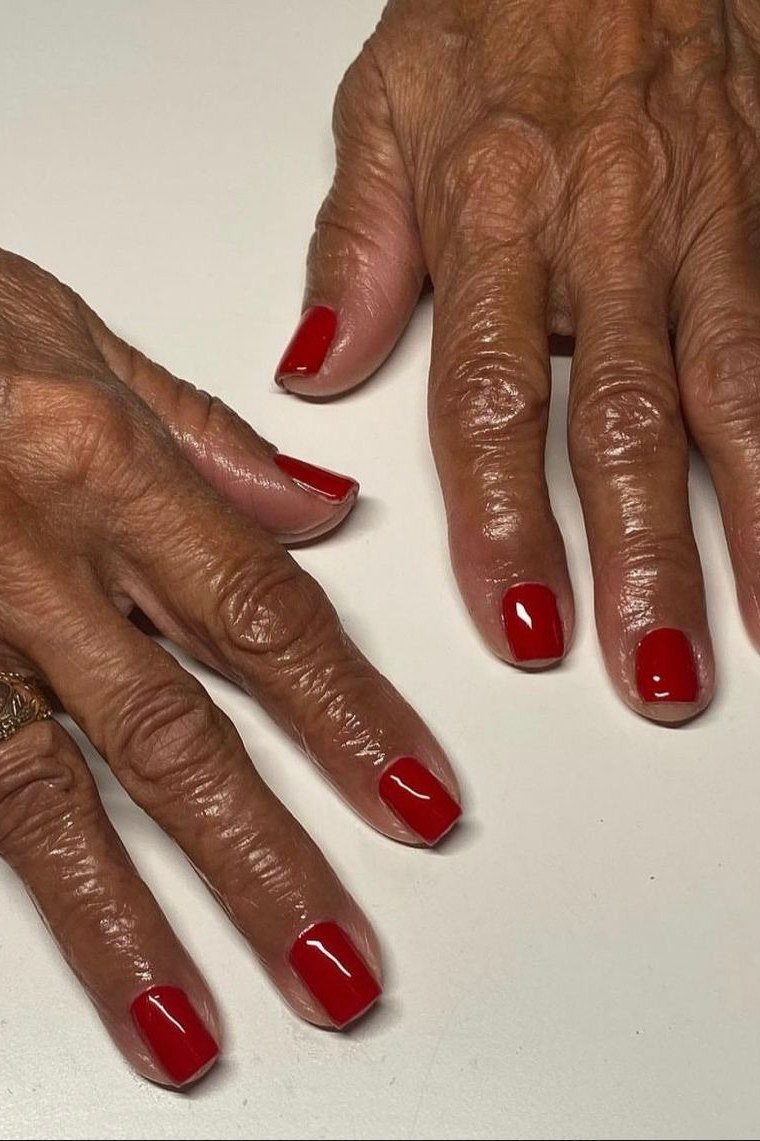 Short Red Nails on Dark Skin, fall nail color idea for women over 50
