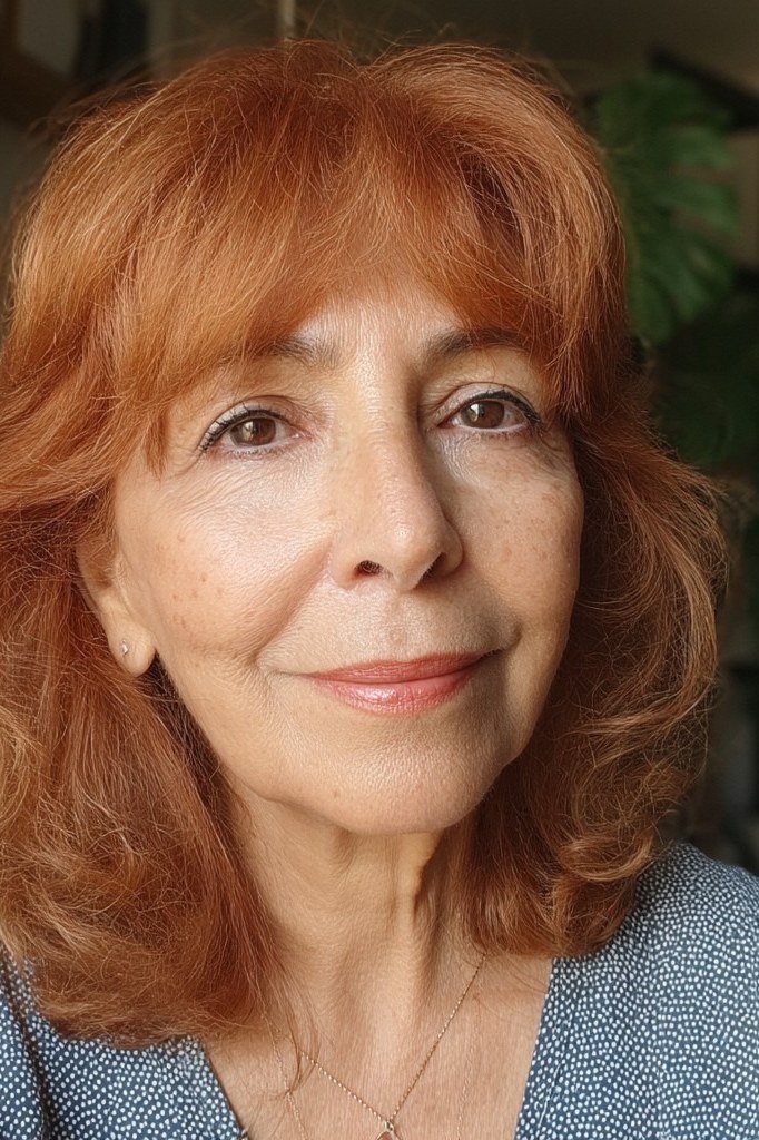 Copper wavy shoulder-length hair, front view, smiling, classic hairstyle for women over 70