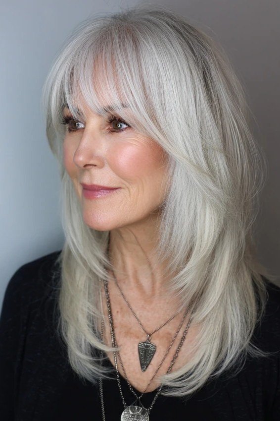 white layered long bob, three-quarter view for women over 50