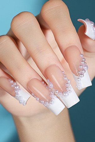 Pearl embellished french gel nails for mature hands