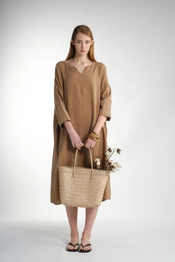 Camel v-neck midi dress with woven basket bag for women over 60