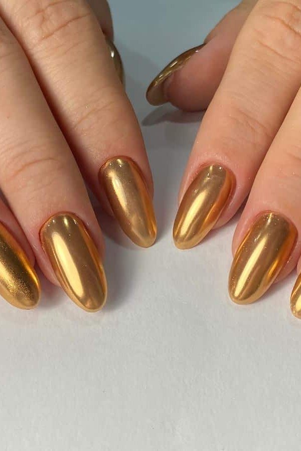 Rich Gold Chrome on Almond Nails - chrome nail designs for women over 60