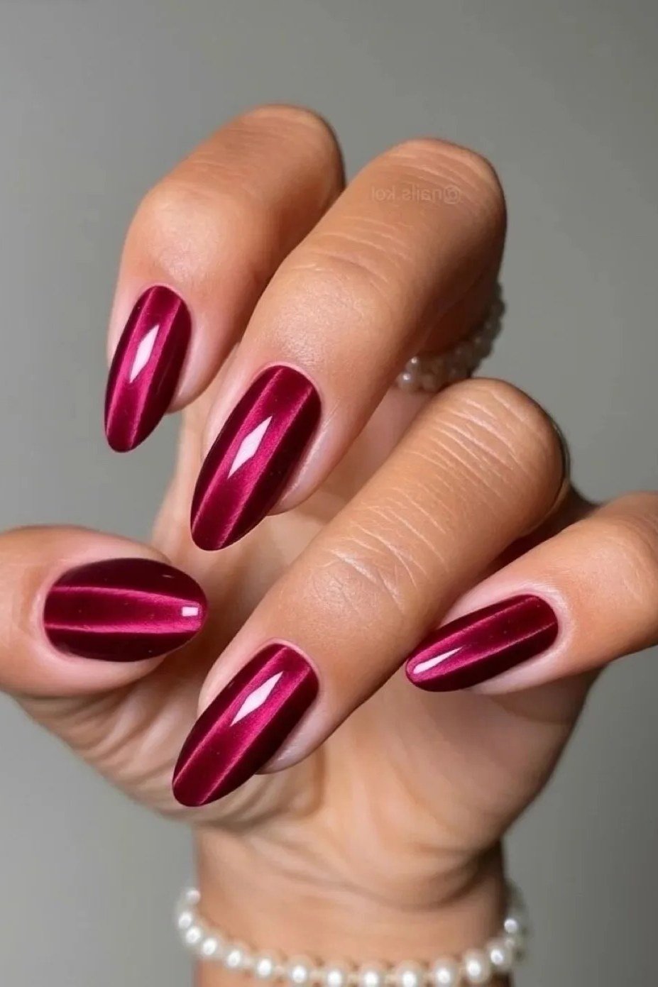 Metallic magenta almond, burgundy fall nail idea for women over 60
