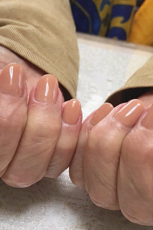Glossy Nude Manicure for women over 60