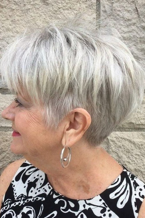 White feathered pixie, airy layers, three-quarter view for women over 60