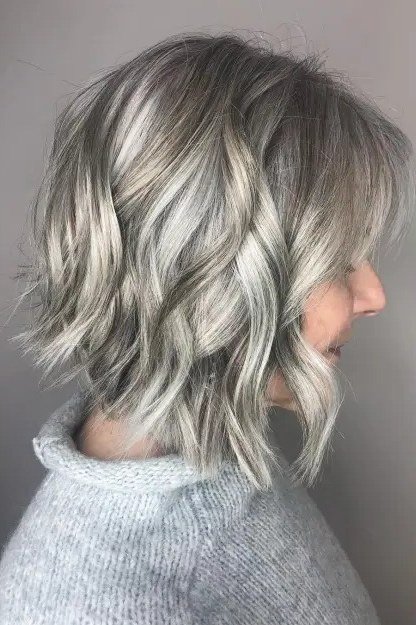 Silver wavy bob, side view - wispy hairstyle for women over 40