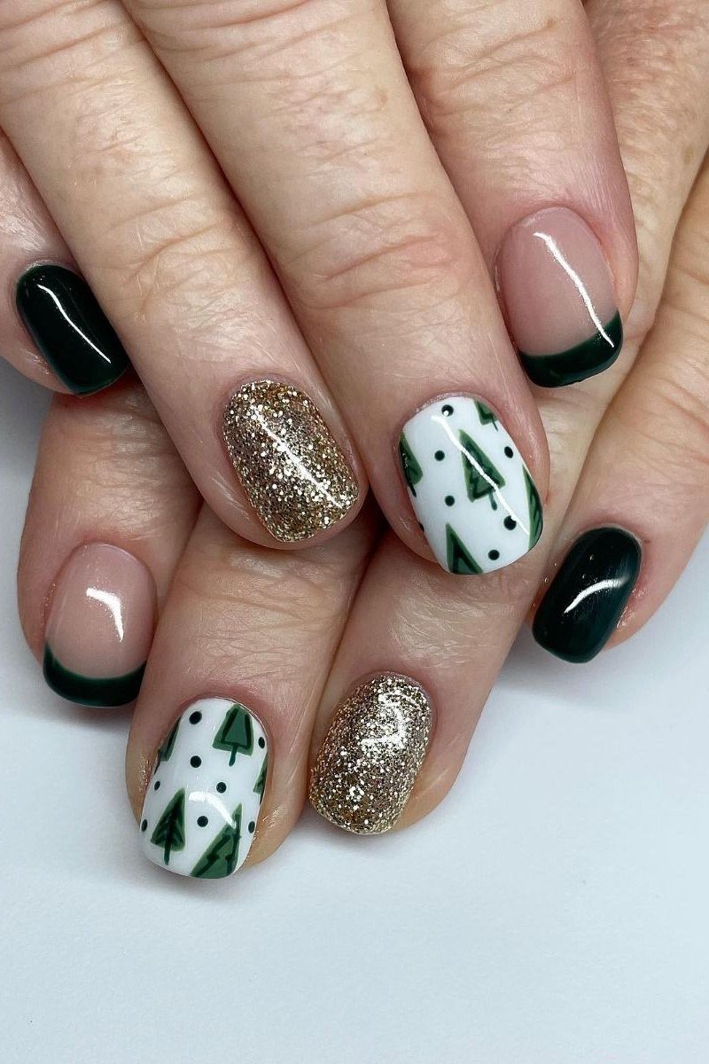 Black with gold glitter and Christmas tree art - Christmas nail design for older women
