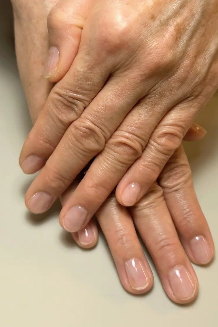 Glossy Nude on Mature Hands - short nail design for women over 40