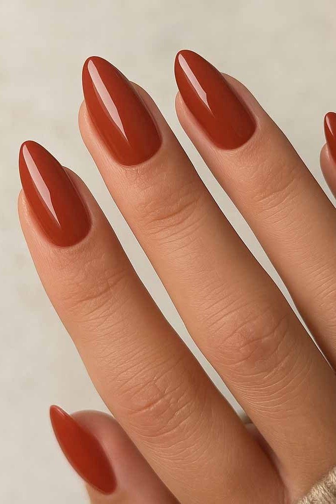 Burnt orange glossy almond, elegant fall nail design for women over 40