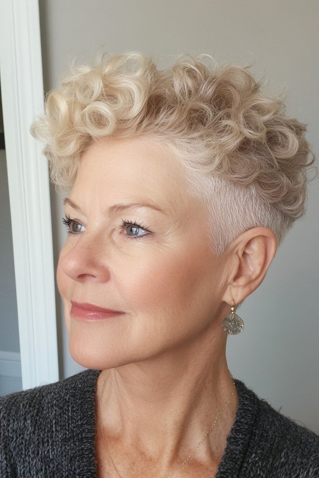 White short curly pixie bixie haircut side view for women over 60