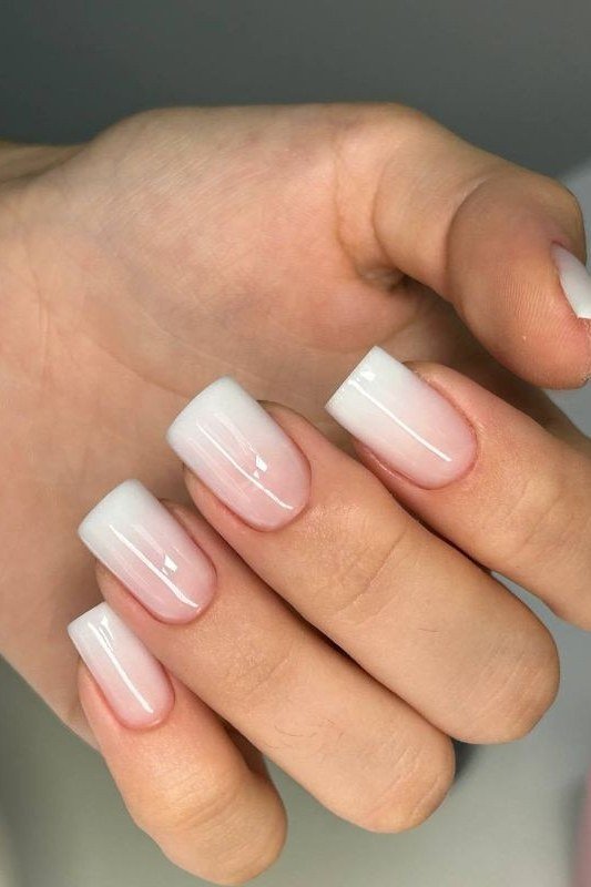 pink white baby boomer fade on short almond nails