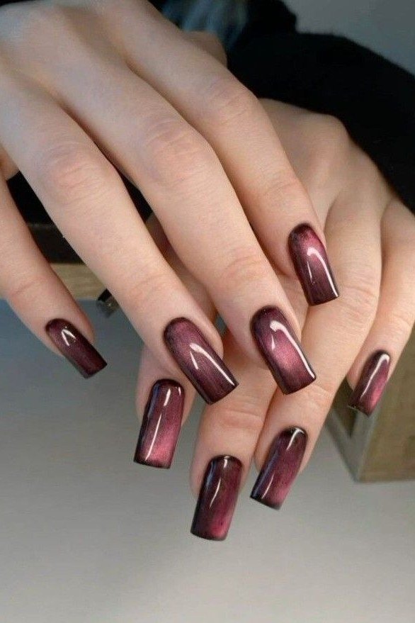 Cat-eye burgundy almond, burgundy fall nail idea for women over 60