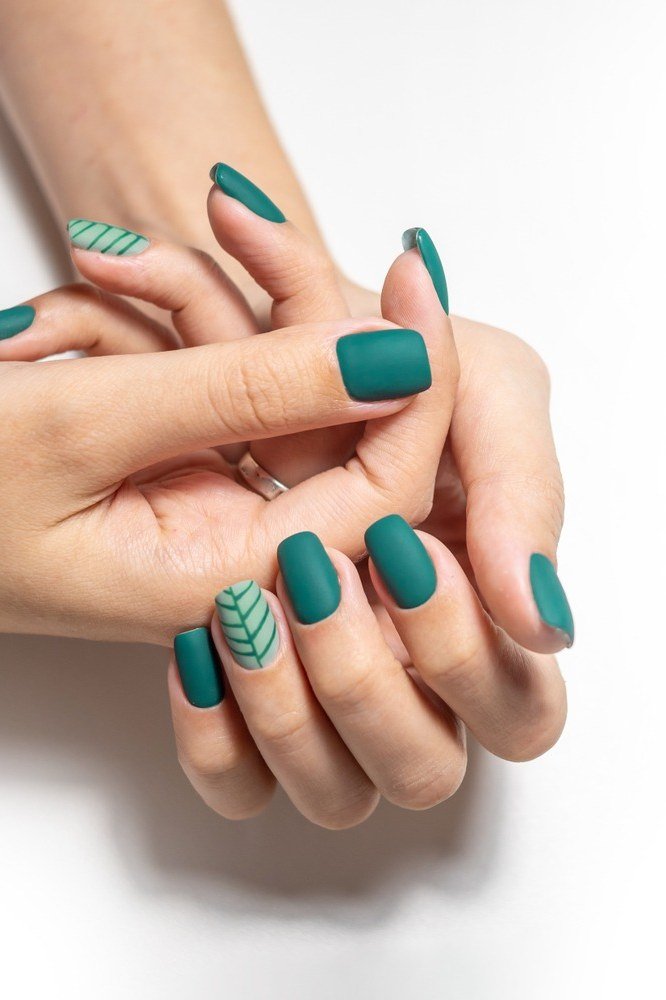 Teal Glossy Nails with White Leaf Accent for women over 60