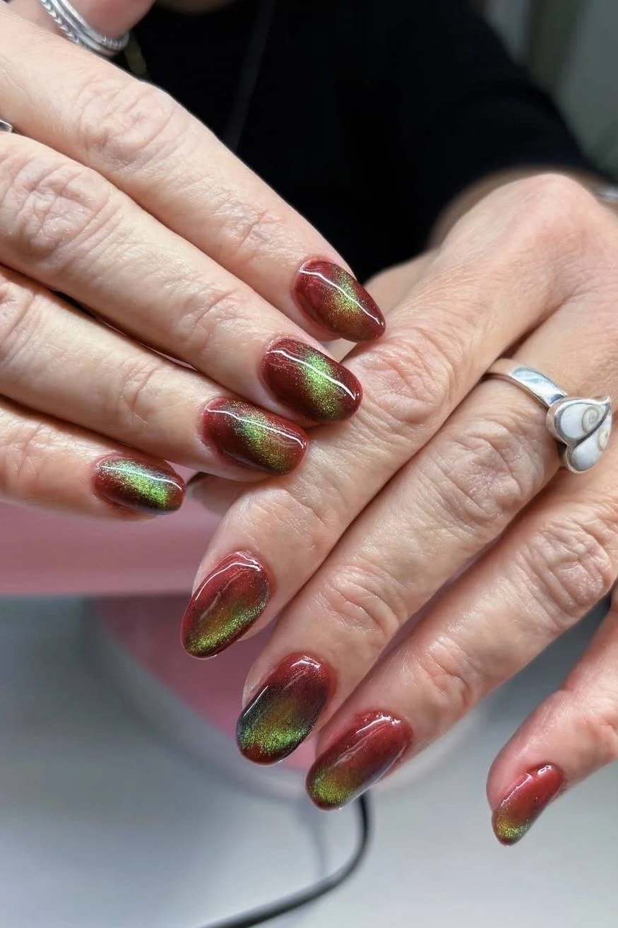 Red Gold Chameleon Cat Eye Nails - Deep red shifts to golden green shimmer under the magnetic effect on these short, oval nails.