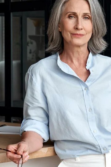 Work outfit for women over 40: light blue button shirt