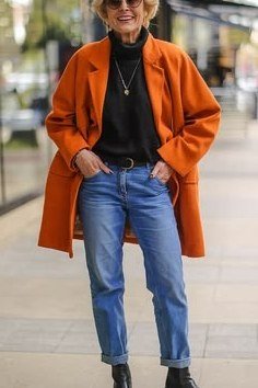 rust blazer black turtleneck cuffed jeans boots fall outfit