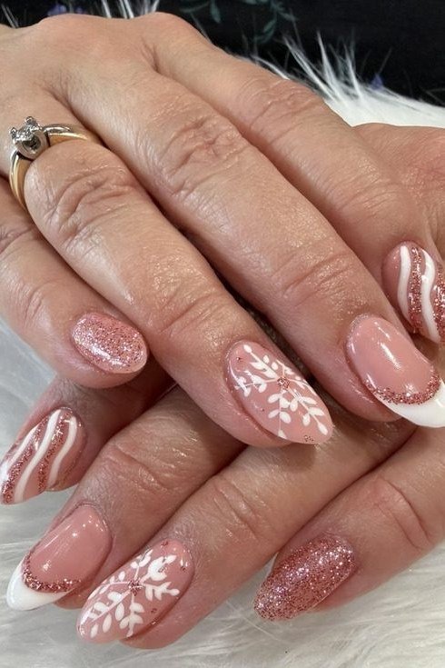 Pink shimmer with white snowflake, mature hands - Christmas nail design for older women