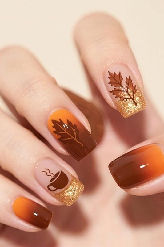 Ombre orange brown with leaf art and coffee cup, elegant fall nail design for women over 40