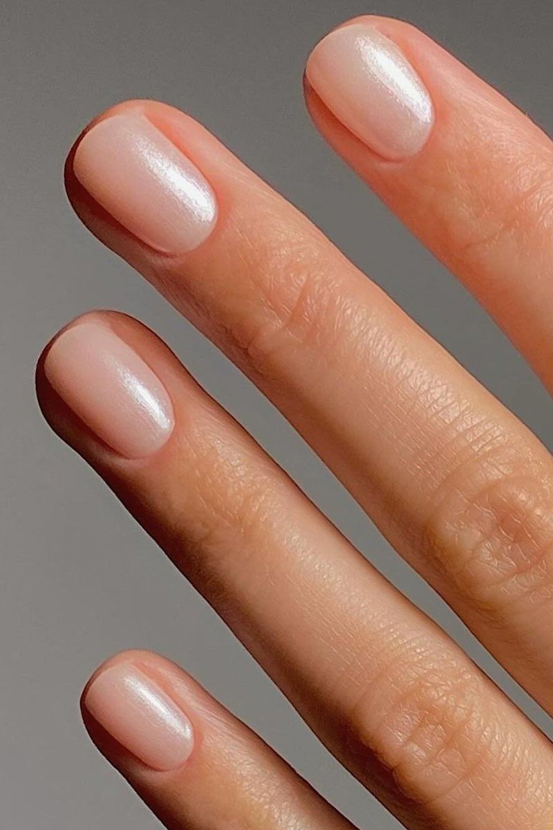 Sheer Milky Nude Almond - short nude nail idea for women over 50