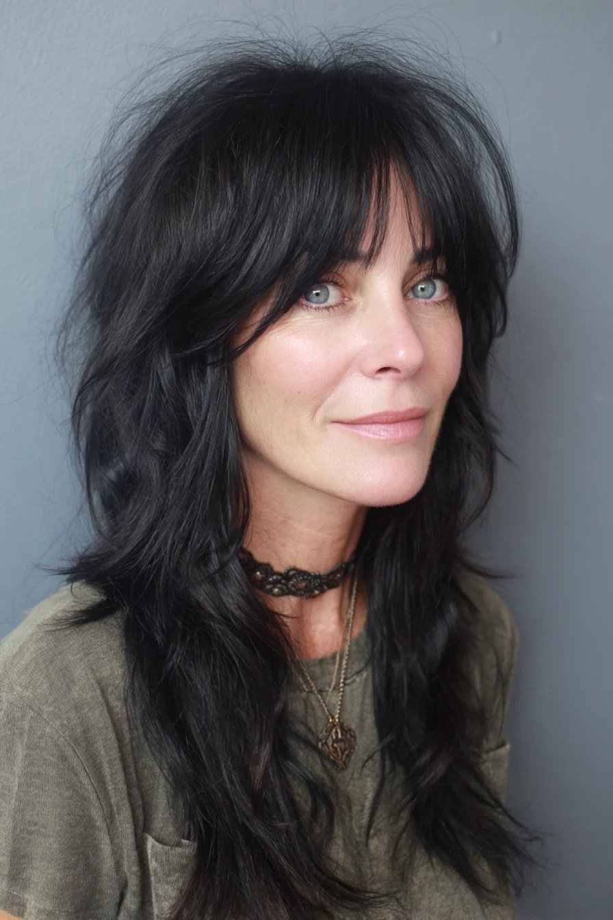 Long black shaggy layers with bangs for women over 50