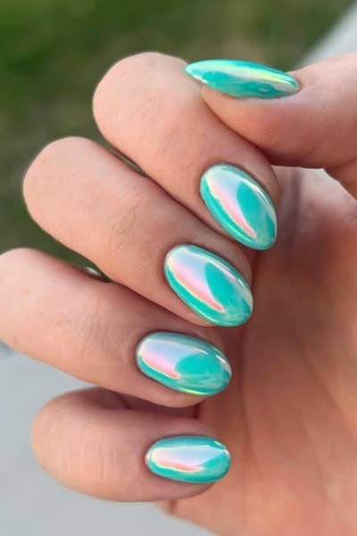 Teal chrome shimmer almond shaped nails modern manicure