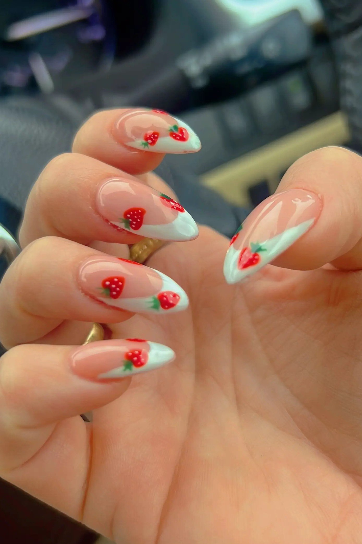 French tip nails with tiny strawberry and leaf art