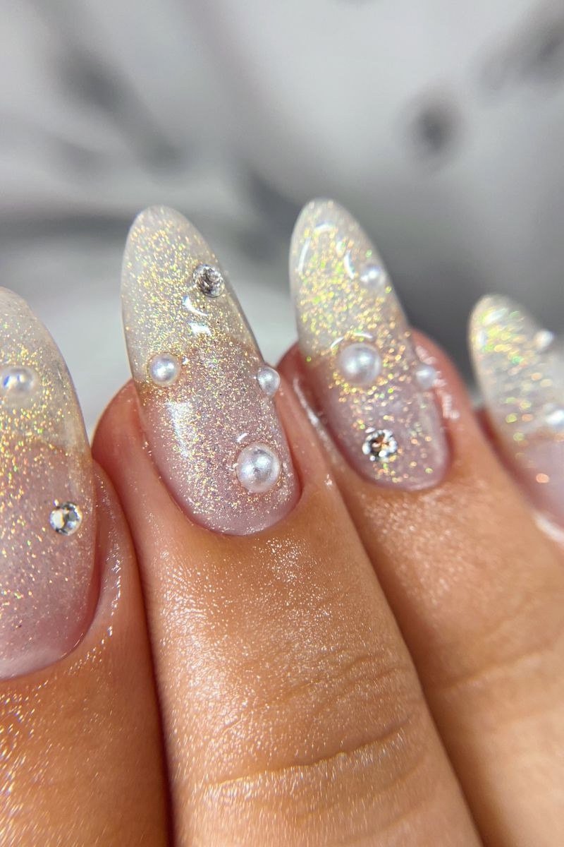 Gold Shimmer Pearl Almond Nails - pearl finish nail idea for women over 60