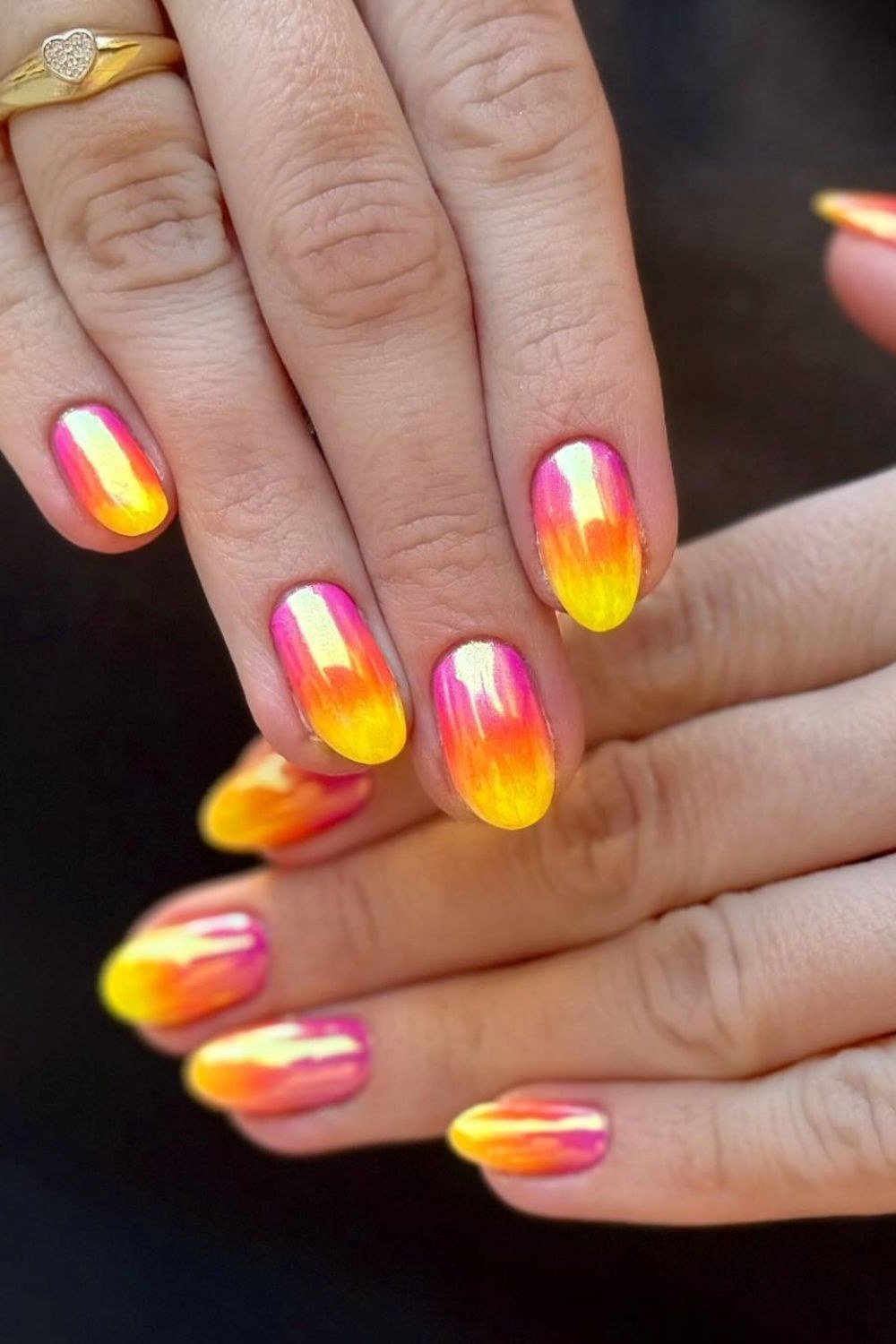 Neon Flame Orange Pink Round Ombre - Blazing orange melts into hot pink on these short round nails with a glassy shine.