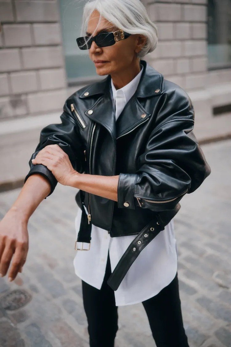 Black moto jacket with white shirt fall outfit idea for women over 60