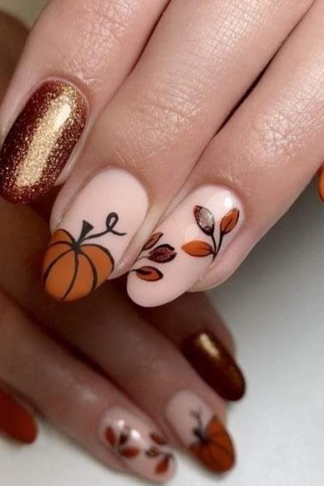 Nude with pumpkin leaf art and copper glitter almond, elegant fall nail design for women over 40