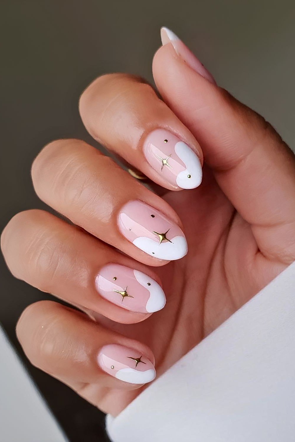 pink christmas nails with gold star accents