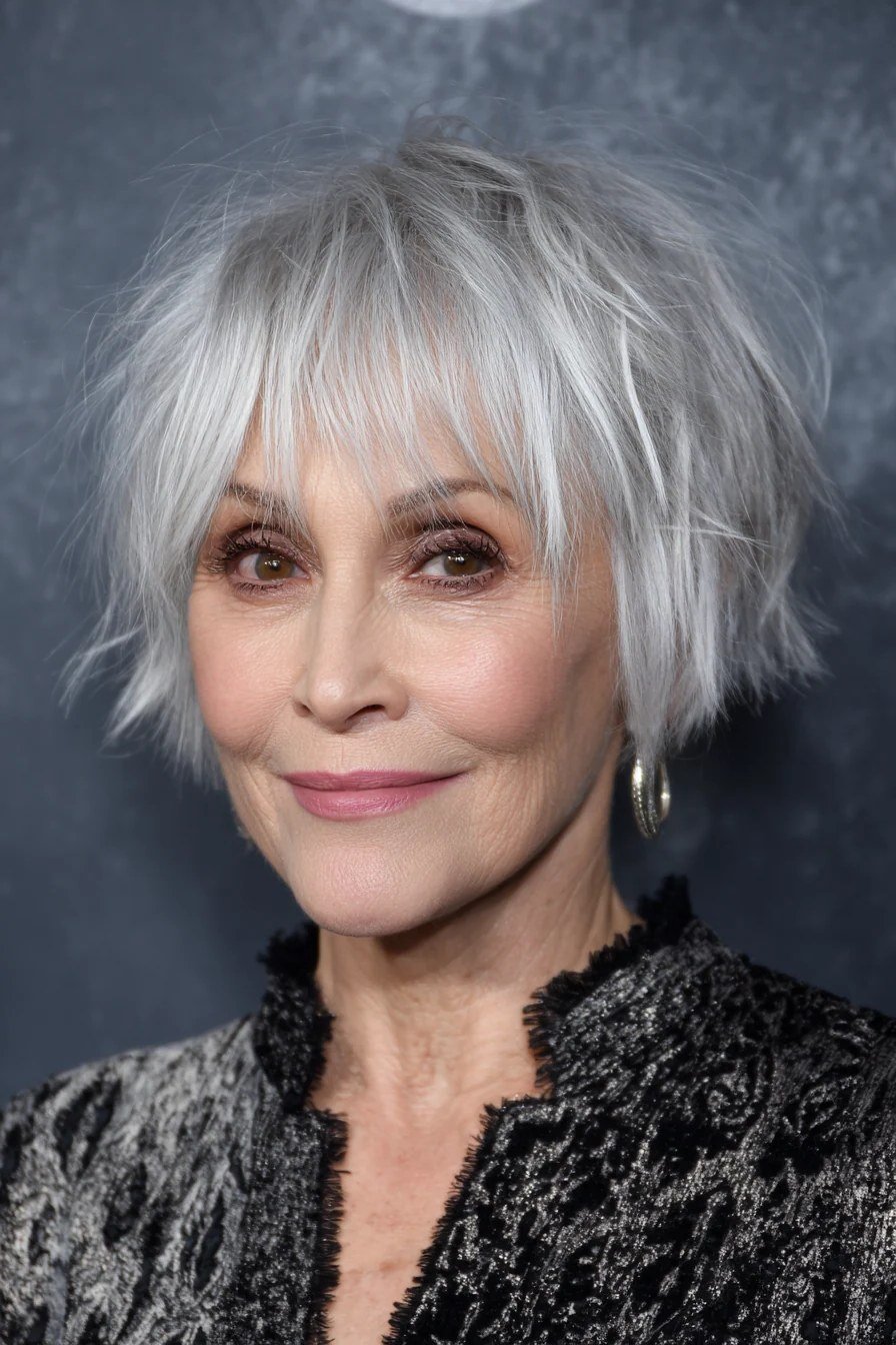Cropped white shaggy bob with bangs for women over 60, front view