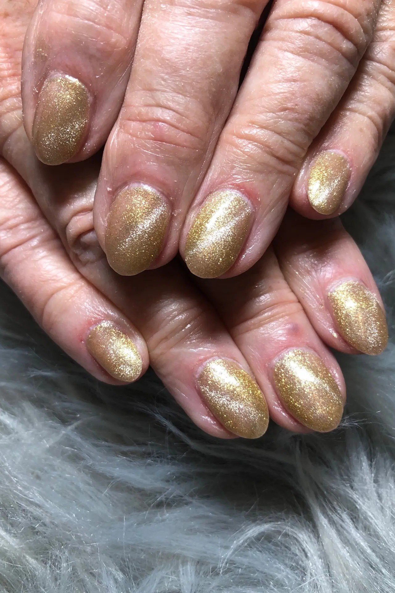 Gold Glitter Short Oval Nails - winter nail trend for older women over 70