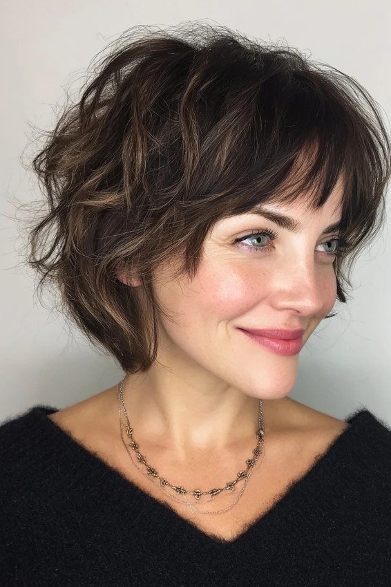Modern Dark Brunette Shaggy Bob with Bangs - medium shag haircut for women over 40