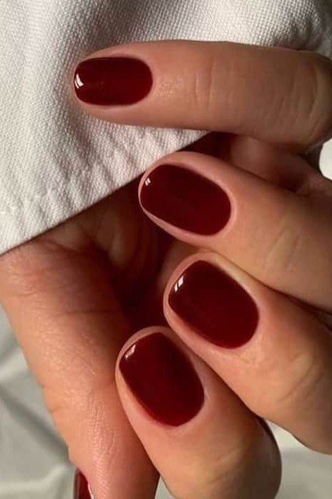 Dark Red Oval - short nail design for women over 60 that makes nails look longer