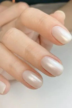 Champagne Pearl Short Almond Nails - pearl finish nail idea for women over 60
