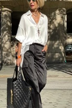 white satin shirt dark gray trousers evening over 50