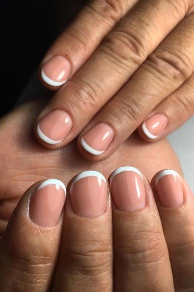 Nude french tip nails palm view for women over 50