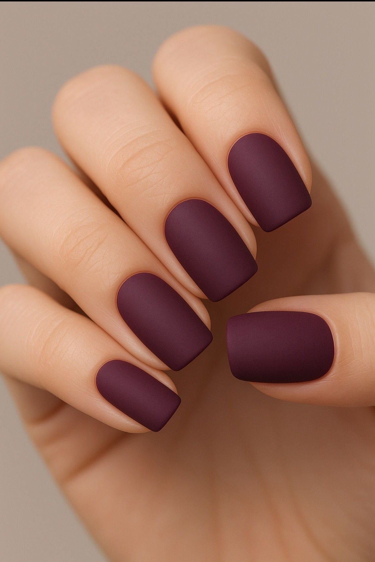 Matte burgundy almond nails for women over 50