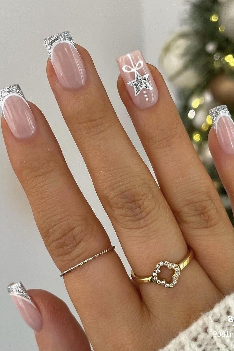 nude nails with silver glitter french tips
