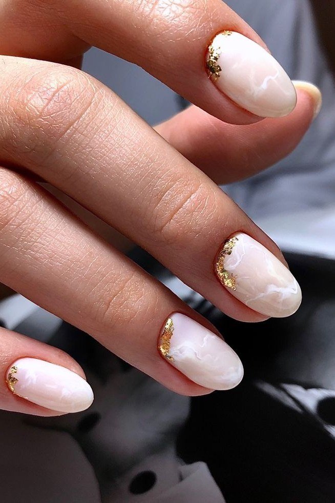 Milky white nails with gold foil tips