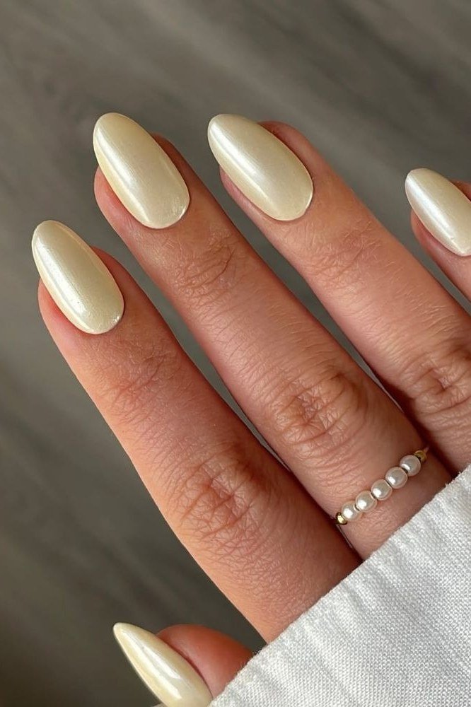 Champagne Pearl Oval Nails - pearl finish nail idea for women over 60