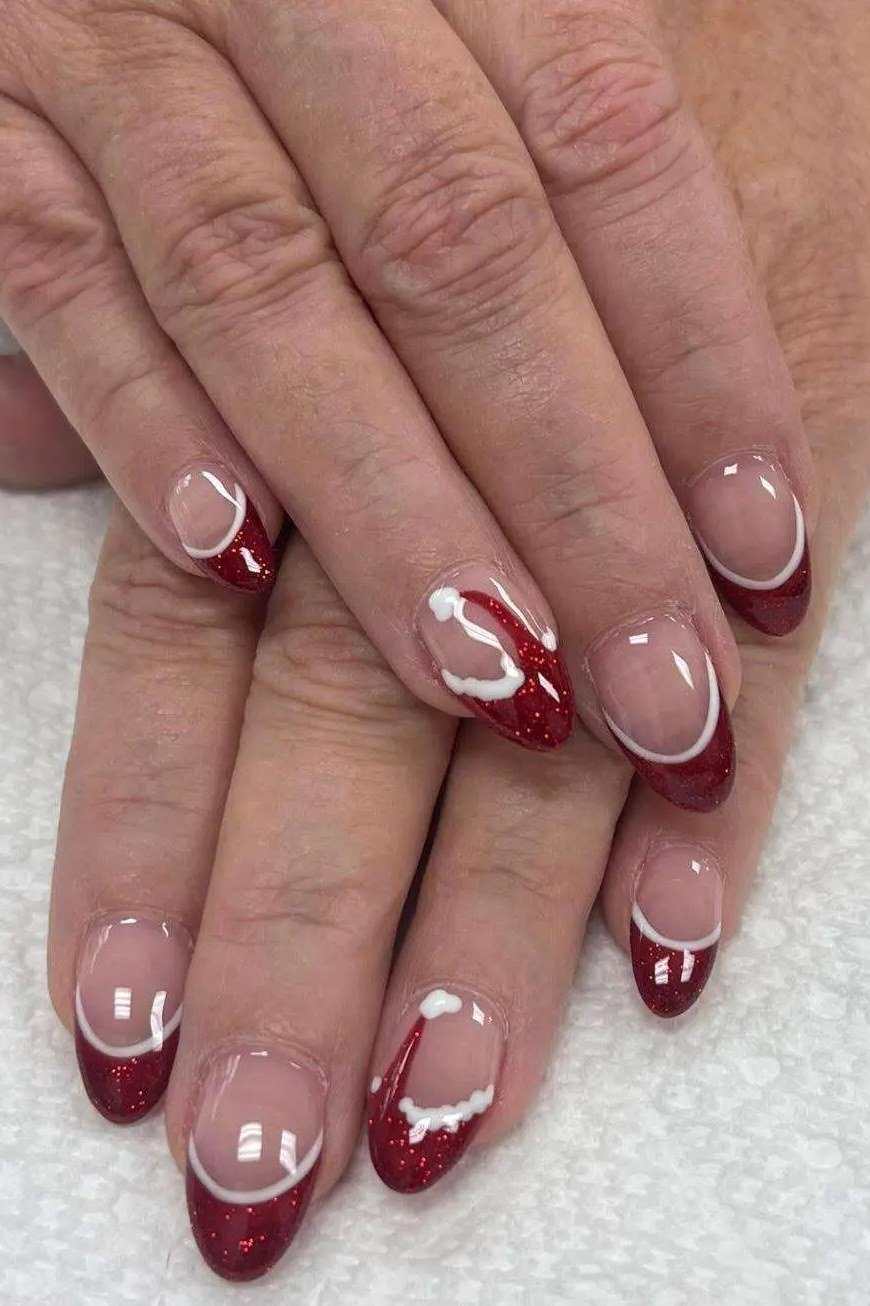 Red French tips with white snowflake art - classy Christmas nail idea for women over 70