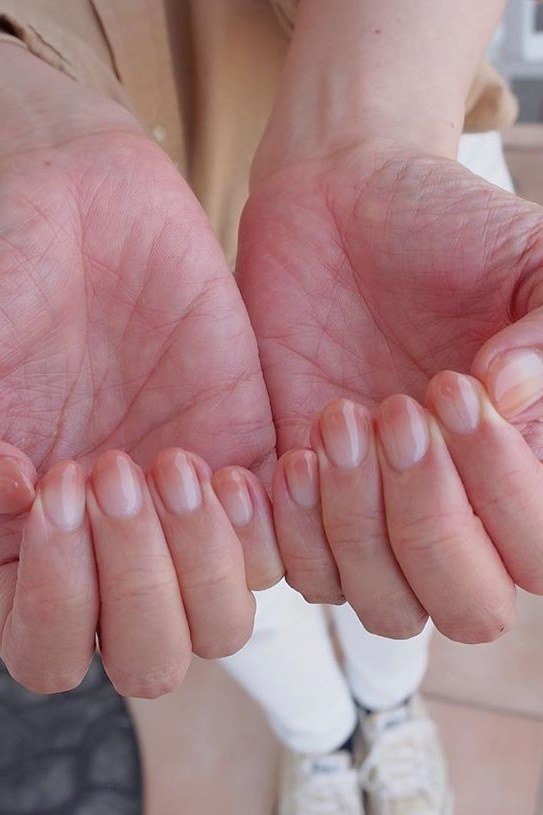 Short nude nails cupped palms for women over 50