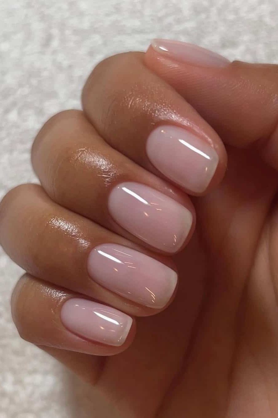 short squoval, sheer nude, hand on brown skin tone , for women over 60