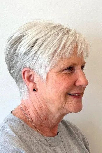 Polished white pixie for women over 70, side view