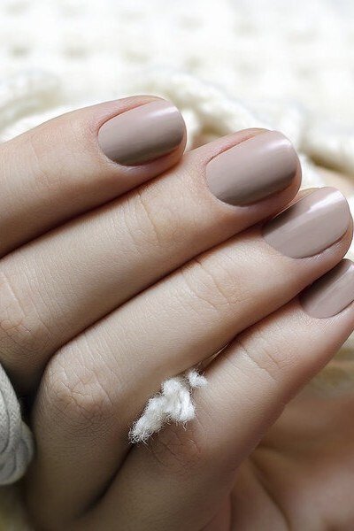 matte taupe oval gel nails with velvety finish, matte neutral nail idea for older women